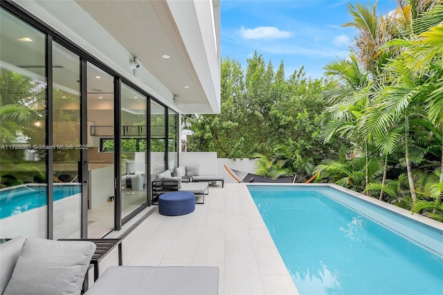 view of pool with an outdoor living space