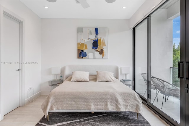 bedroom featuring light wood-type flooring, ceiling fan, and a closet