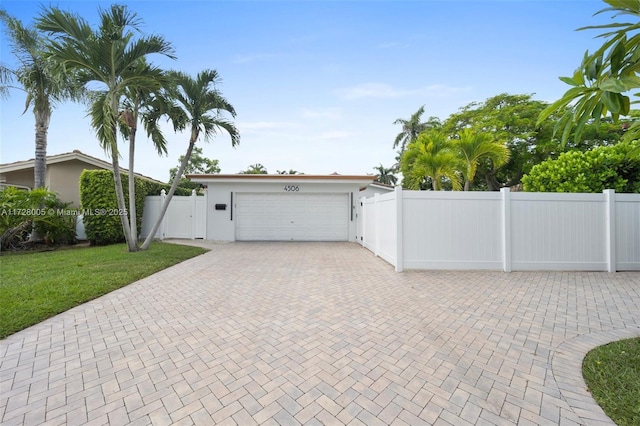 view of front of house with a front lawn and a garage