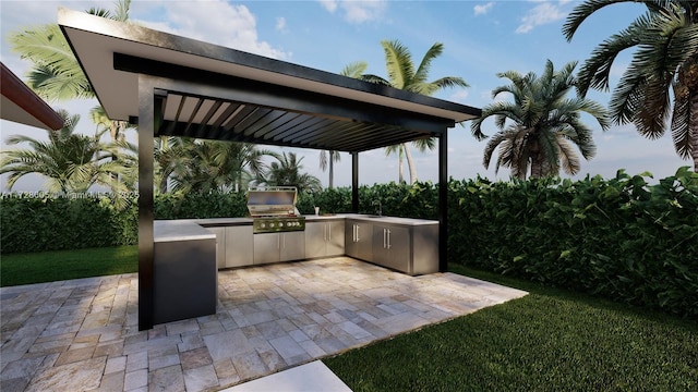 view of patio / terrace featuring an outdoor kitchen, area for grilling, and sink