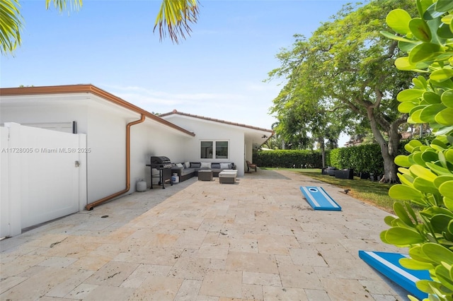 view of patio / terrace featuring outdoor lounge area and a grill