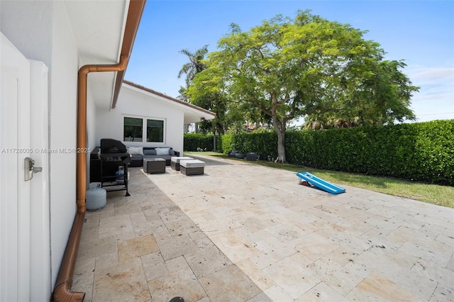 view of patio with an outdoor living space and grilling area