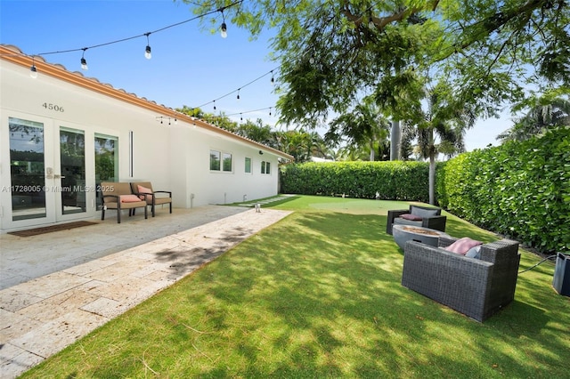 view of yard with an outdoor hangout area, french doors, and a patio area