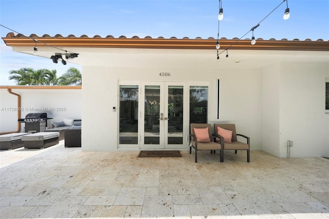 back of property with french doors and a patio