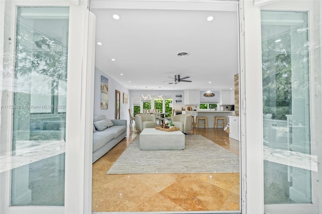 living room featuring ceiling fan