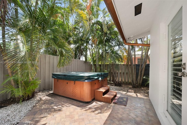 view of patio with a hot tub