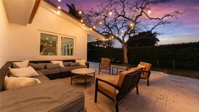 patio terrace at dusk with an outdoor living space