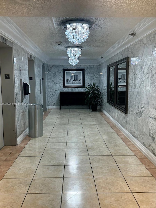 hallway with light tile patterned floors, crown molding, a chandelier, and a textured ceiling