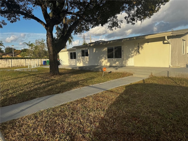 view of front of home with a front yard