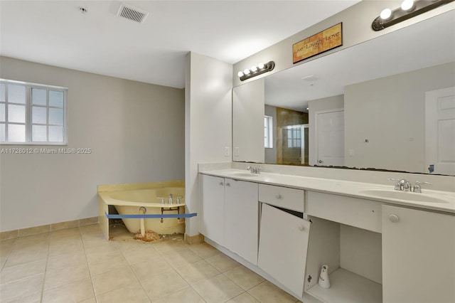 bathroom featuring shower with separate bathtub, tile patterned floors, and vanity