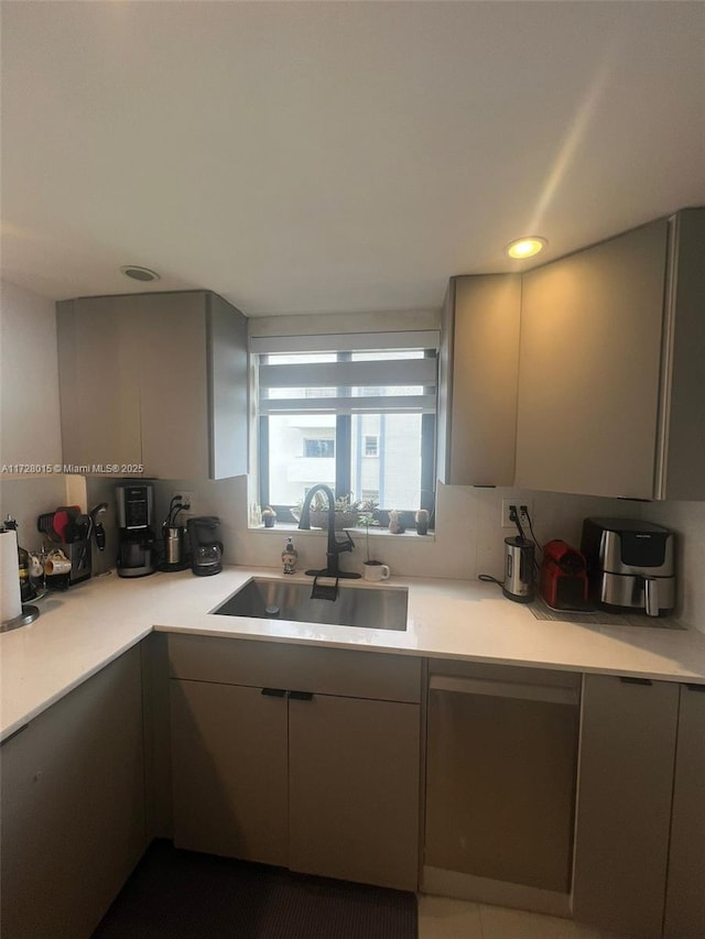 kitchen with sink and gray cabinets