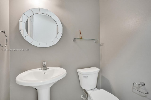 bathroom with sink and toilet