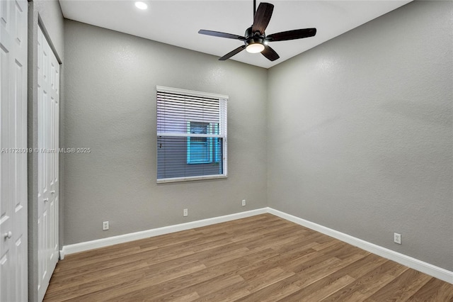 unfurnished bedroom featuring ceiling fan and hardwood / wood-style flooring