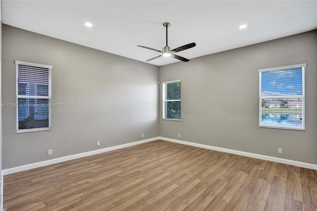 unfurnished room featuring ceiling fan and light hardwood / wood-style flooring