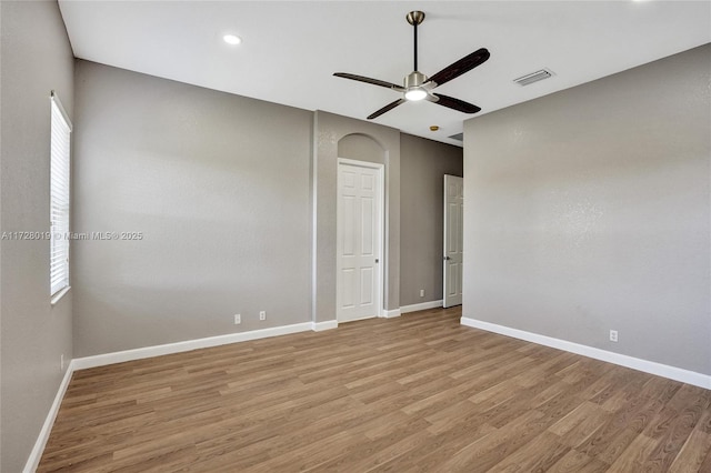 spare room featuring ceiling fan and light wood-type flooring