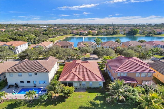 birds eye view of property with a water view