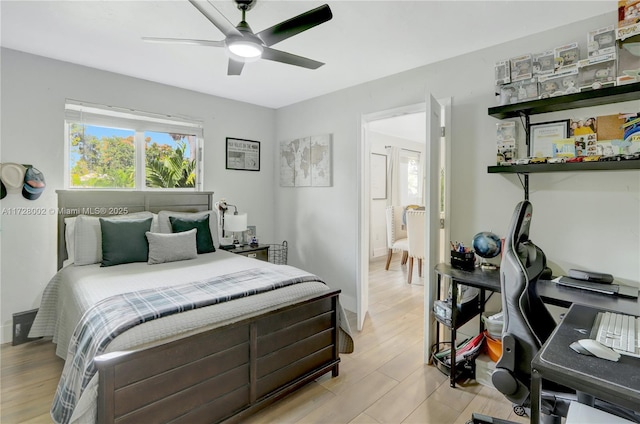 bedroom with ceiling fan and light hardwood / wood-style flooring