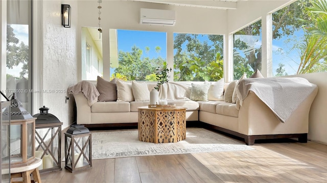 sunroom / solarium featuring a wall mounted AC