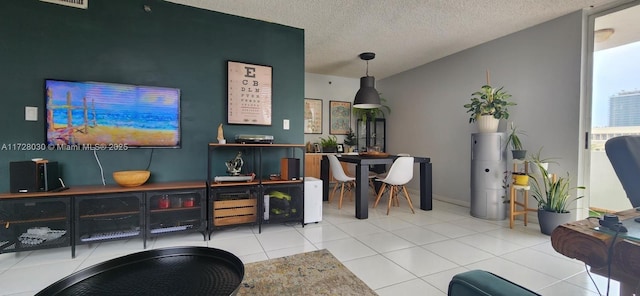 tiled living room with a textured ceiling