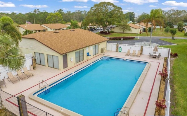 view of swimming pool featuring a patio area