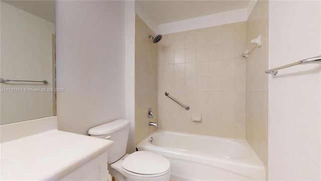 full bathroom featuring toilet, tiled shower / bath combo, and vanity