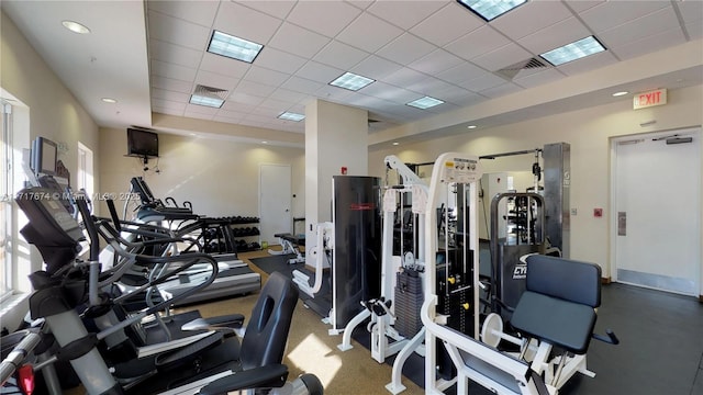 workout area featuring a paneled ceiling