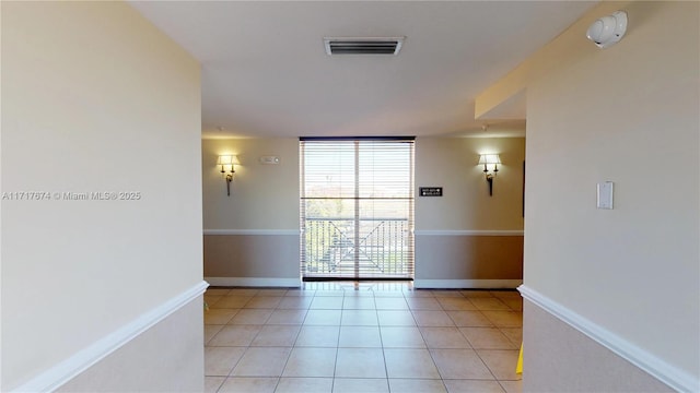 empty room with light tile patterned flooring