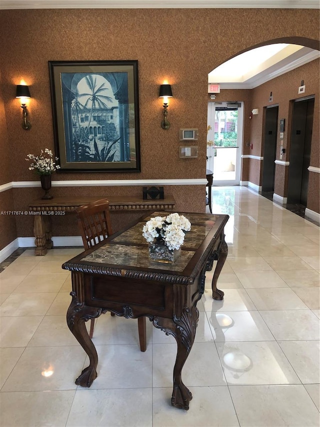 tiled dining area featuring crown molding and elevator