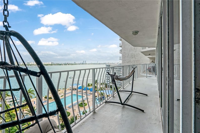 balcony featuring a water view