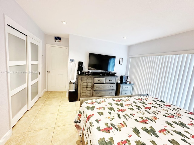 bedroom featuring light tile patterned floors