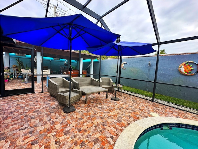 view of patio / terrace with an outdoor living space and glass enclosure