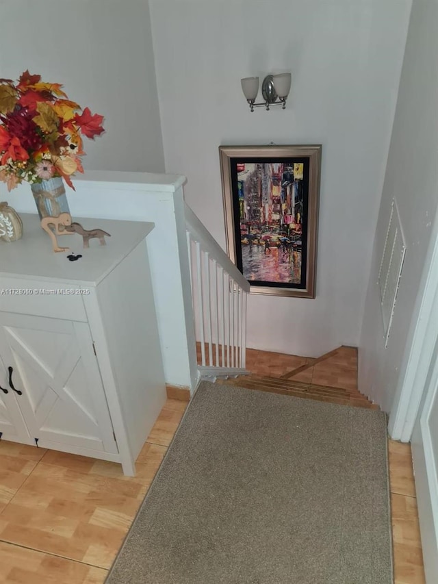 staircase featuring hardwood / wood-style flooring