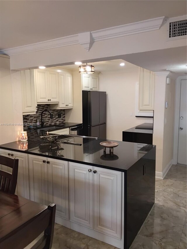 bathroom with toilet, vanity, and crown molding