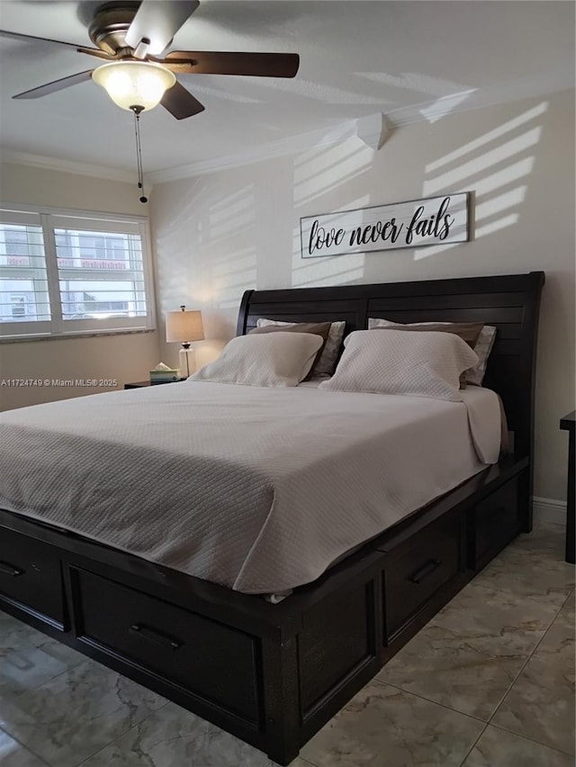 bedroom featuring marble finish floor, ceiling fan, and ornamental molding