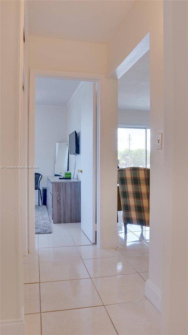 hall with light tile patterned floors