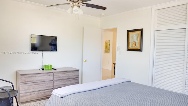 bedroom featuring ceiling fan and crown molding