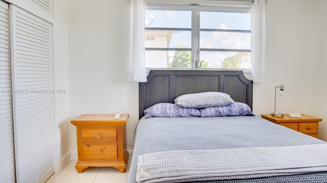 bedroom with light tile patterned flooring