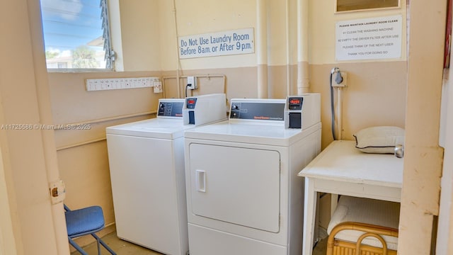 laundry room with washing machine and clothes dryer