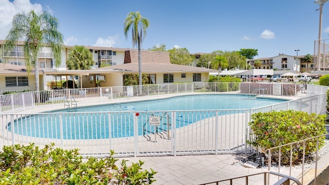 view of swimming pool with a patio