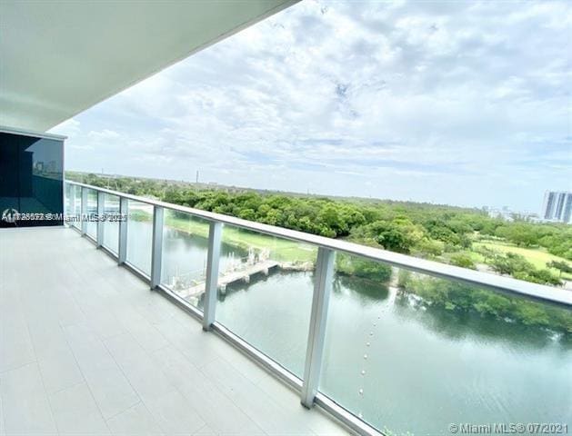 balcony featuring a water view