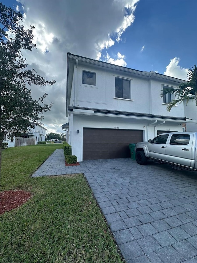 view of front property with a garage and a front yard