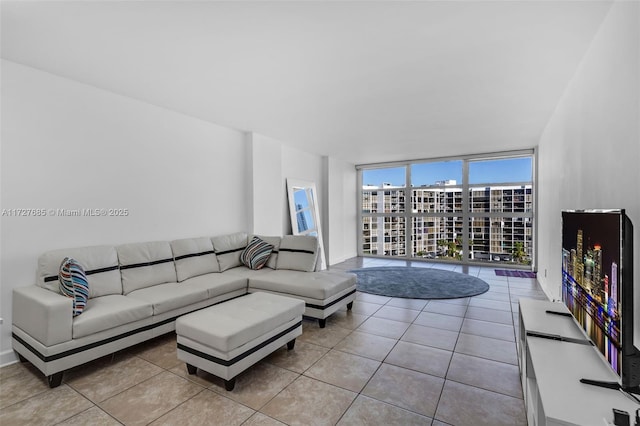 tiled living room with floor to ceiling windows