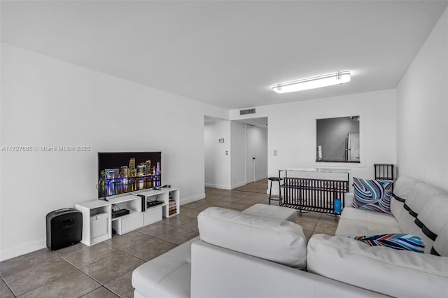 living room with tile patterned flooring