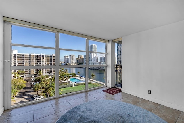 sunroom with a water view and plenty of natural light