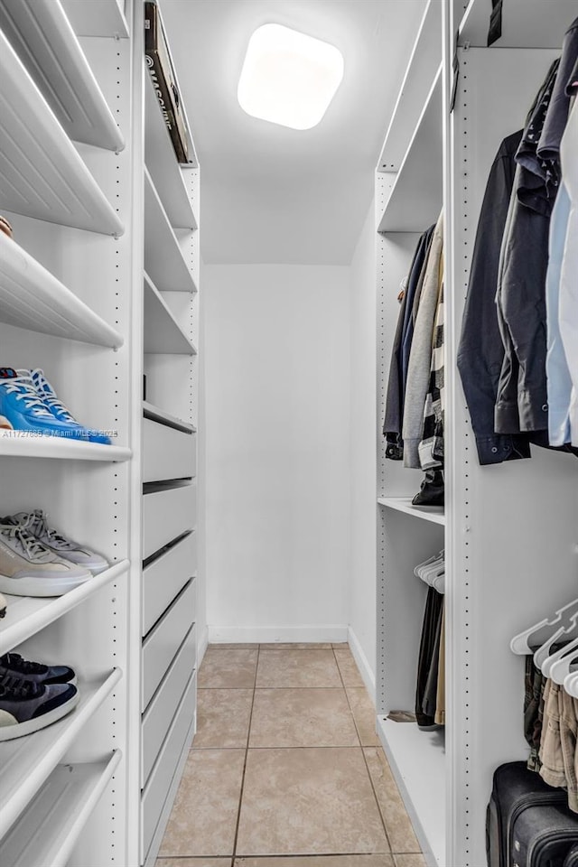 walk in closet featuring light tile patterned floors