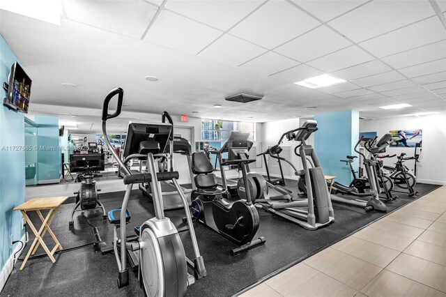 exercise room with a drop ceiling