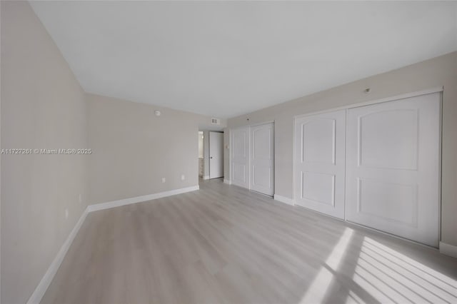 unfurnished bedroom featuring light hardwood / wood-style flooring