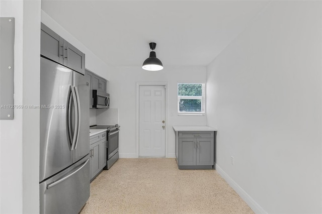 kitchen featuring gray cabinets and stainless steel appliances