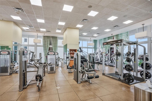 exercise room featuring a drop ceiling