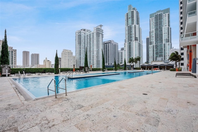 view of swimming pool with a patio area